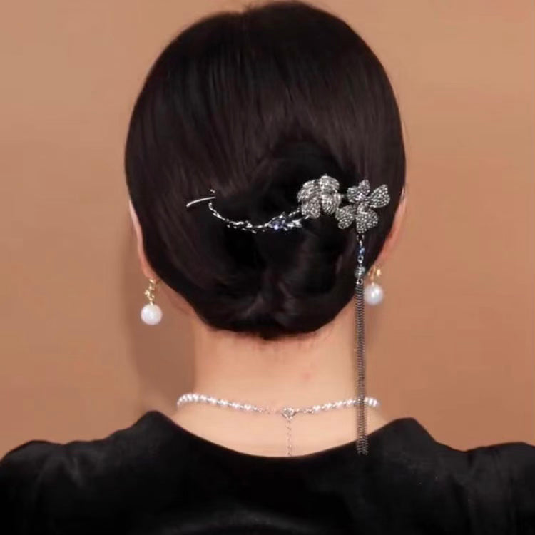 Rotating black flower hairpin