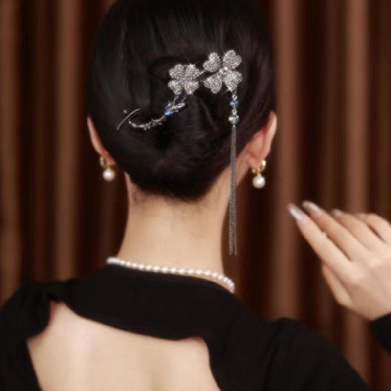 Rotating black flower hairpin