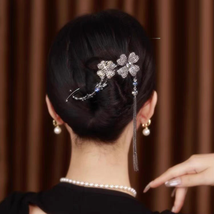 Rotating black flower hairpin